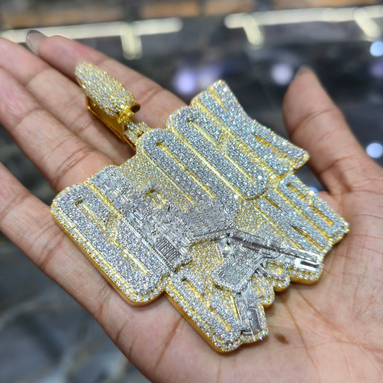 WhatsApp Image 2026-04-30 at 12.12.22 AM Diamond Iced Glock Pendant with Golden Detailing - Image 1
